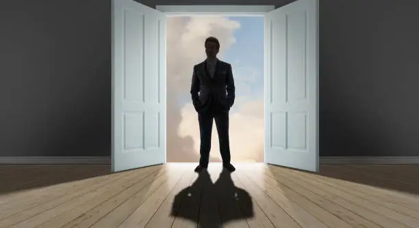 Businessman standing at threshold