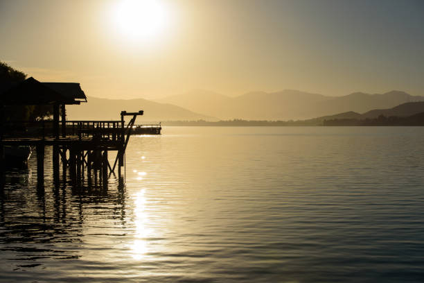istock sunrise on a dock in a lake 1248317157