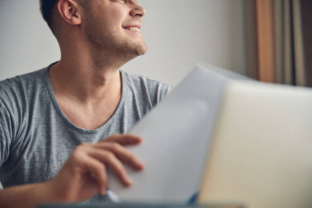 istock Young handsome man having papers in his hands 1248317561