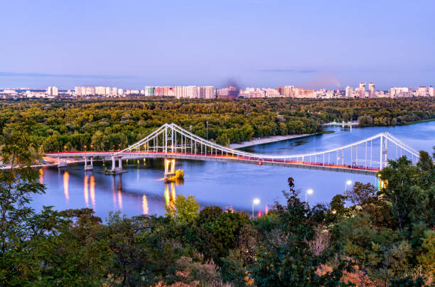 istock Pedestrian bridge across the Dnieper River in Kiev, Ukraine 1248318113
