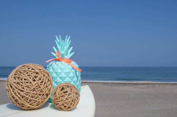 istock String Balls on a white surfboard with beach and ocean background 1248318216