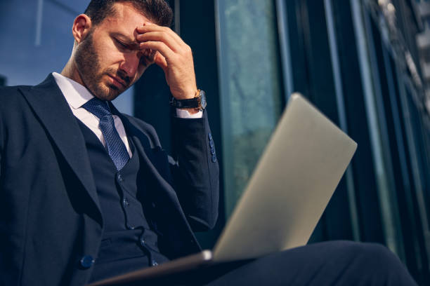 istock Young brunette male working alone online on laptop 1248319724