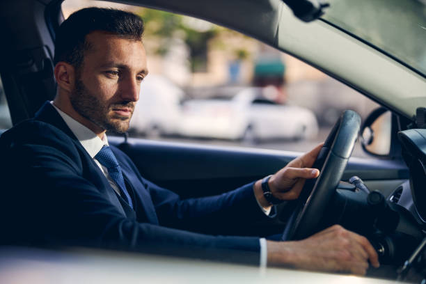 istock Handsome brunette male going alone in auto 1248319773