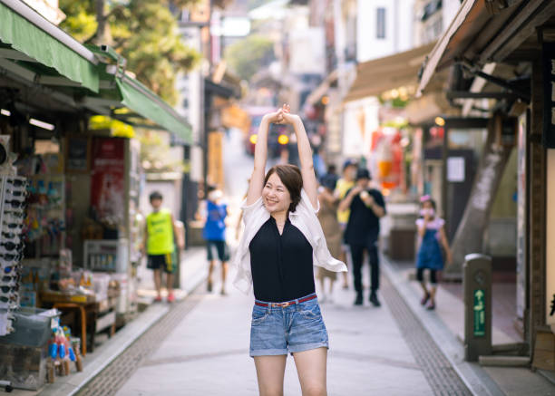 istock Young woman stretching and deep breathing in old town 1248322819