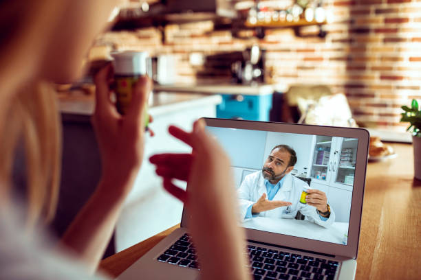 istock Young Woman Consulting with her Doctor 1248323677