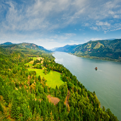 The Columbia Gorge is a canyon of the Columbia River which forms the border between the states of Oregon and Washington. The canyon is up to 4,000 feet deep in places and stretches for over 80 miles as the river winds westward through the Cascade Range. This scene of the Columbia River was taken from Cape Horn near Washougal, Washington State, USA.
