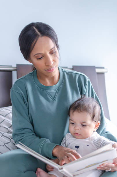 istock Bedtime stories with mom 1248327423