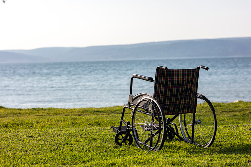 empty wheelchair by the sea