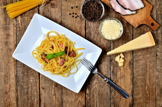 istock Top view at spaghetti Carbonara pasta, with bacon, parmesan cheese, egg. Pasta alla carbonara. 1248327649