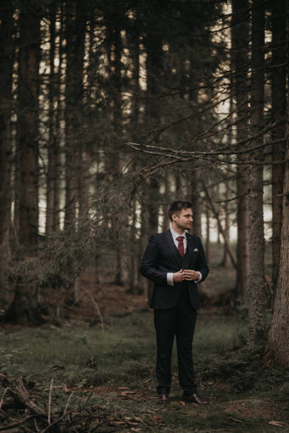 istock Very beautiful bride and groom having romantic time while wind blows wheats in the forest. 1248332545