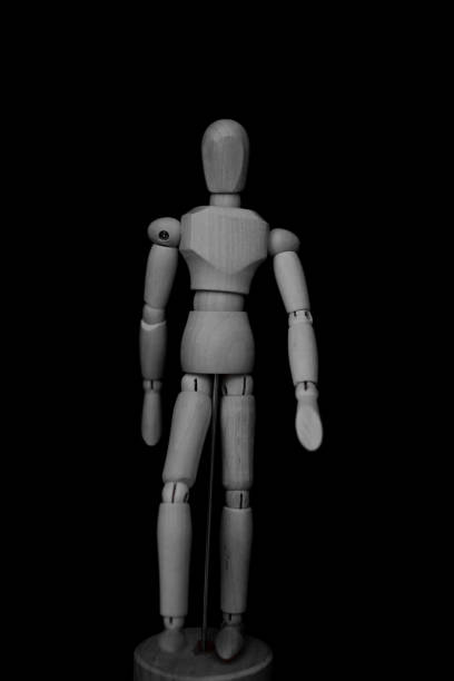 istock wooden mannequin standing on black background with walking forward or backward posture 1248336220