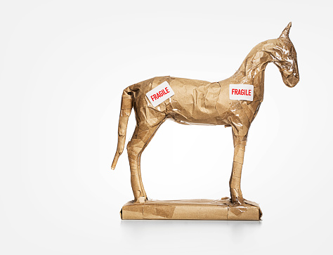 Side view horse figurine wrapped for moving - conceptual