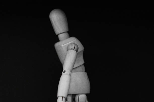 istock wooden mannequin standing on black background with cool posture 1248336245
