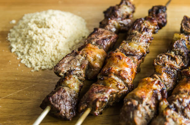 istock Juicy meat barbecue skewer (Churrasquinho, espetinho) in closeup. 1248341065