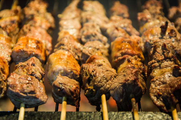 istock Juicy meat barbecue skewer (Churrasquinho, espetinho) in closeup. 1248342109
