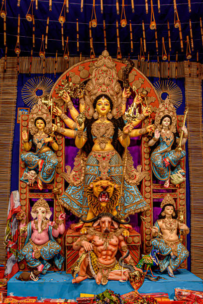 istock Goddess Durga idol at decorated Durga Puja pandal, shot at colored light, in Kolkata, West Bengal, India. Durga Puja is biggest religious festival of Hinduism and is now celebrated worldwide. 1248346608