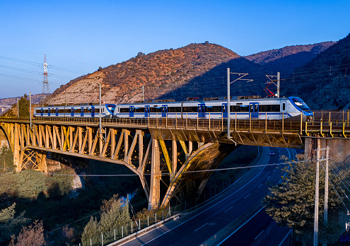 A local train on a steel bridge at Vina del Mar, Chile