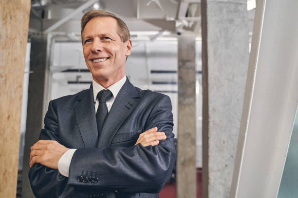 istock Handsome senior man waiting for his colleagues 1248378068