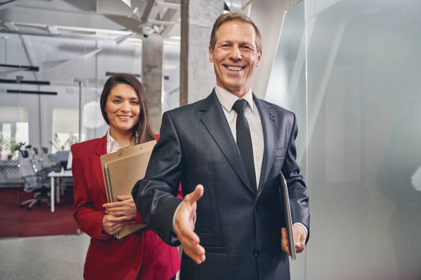 istock Kind senior man welcoming new business partner 1248378088