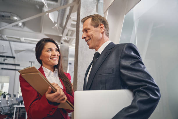 istock Kind senior businessman looking at his colleague 1248378090
