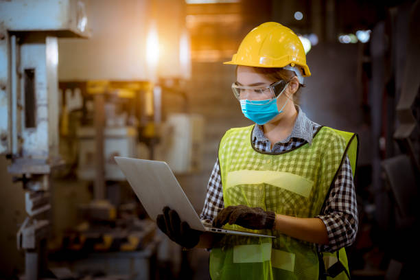 istock Portrait woman worker and engineer under inspection and checking production process on factory station by wearing safety mask to protect for pollution and virus in factory. 1248384555