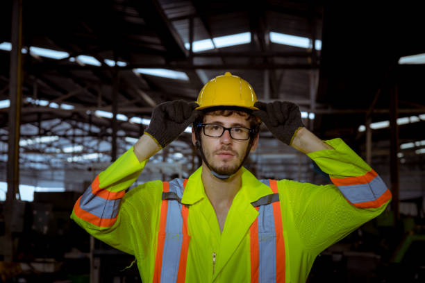 istock The Industry engineering wear safety uniform  standing on control operating machine work in industry factory. 1248386053