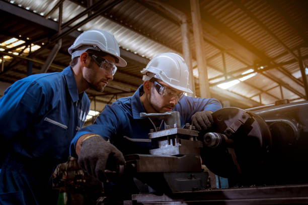 istock The Industry engineering wearing safety uniform used Vernier caliper to measure the object control operating machine working in industry factory. 1248387436