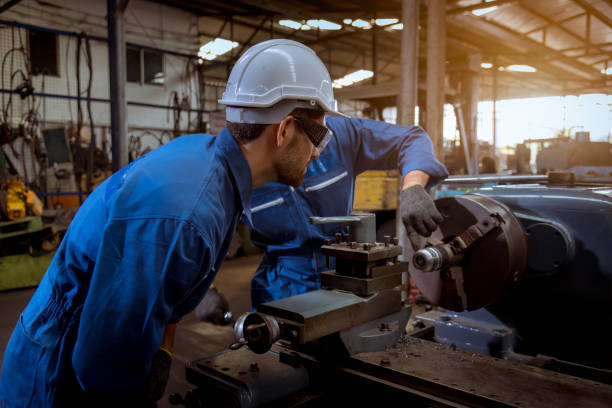 istock The Industry engineering wearing safety uniform used Vernier caliper to measure the object control operating machine working in industry factory. 1248387450