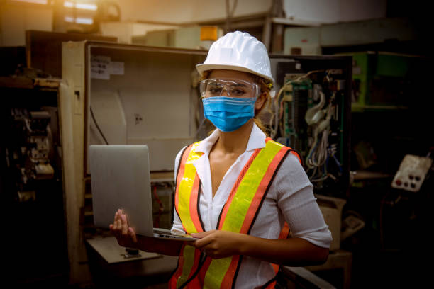 istock Industry engineer under inspection and checking production process on factory station by document on hand ,Engineer wearing casual uniform and safety helmet in work. 1248388579