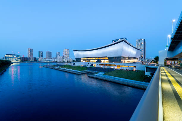 View of Ariake Arena lit up after sunset This is a new arena in the northern part of Tokyo's Ariake district. After the Tokyo 2020 Games, the arena will become a new sporting and cultural centre with a seating capacity for up to 15,000 spectators. paralympic games stock pictures, royalty-free photos & images