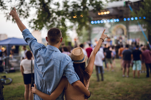 Couple toasting on a music festival