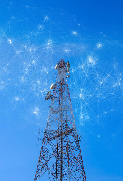 Telecommunication towers with mesh dots, glittering particles for wireless telecommunication technology stock photo