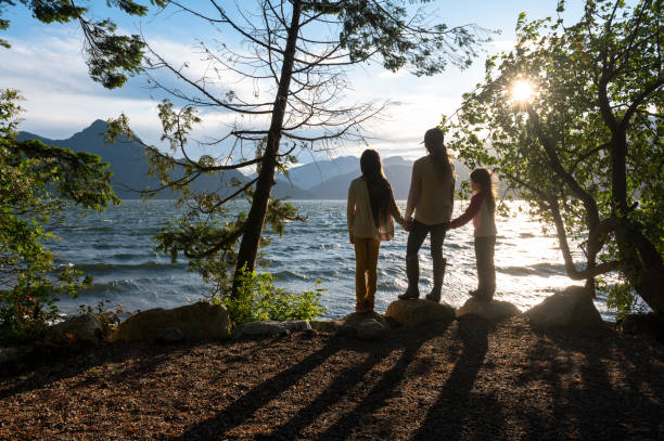 istock Mother and daughters bonding in nature 1248403212