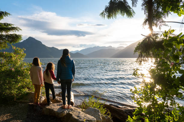 istock Mother and daughters bonding in nature 1248403213