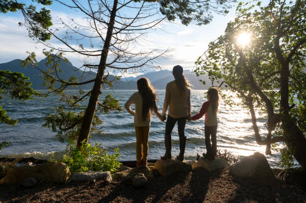 istock Mother and daughters bonding in nature 1248403226