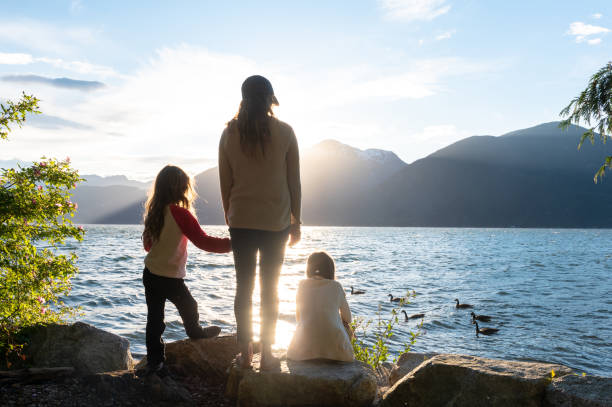 istock Mother and daughters bonding in nature 1248403230