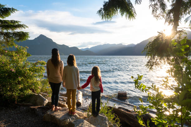 istock Mother and daughters bonding in nature 1248403234