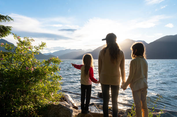 istock Mother and daughters bonding in nature 1248403238