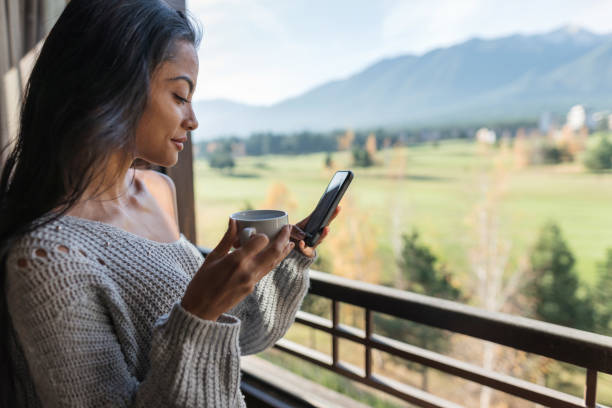 istock Woman chatting on her phone during Covid-19 lockdown 1248404963