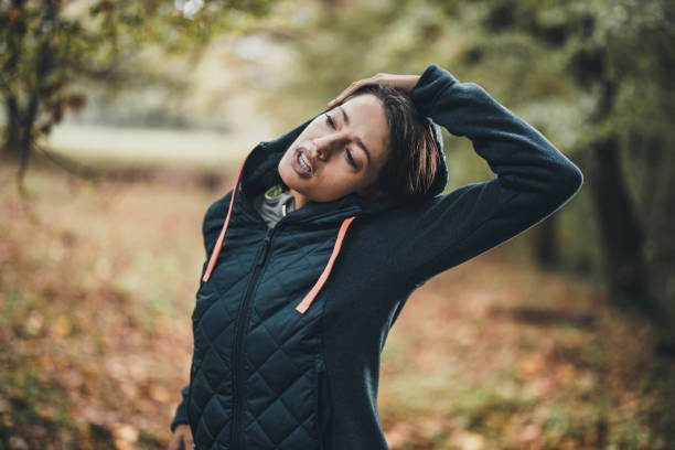 istock Young athletic woman doing stretching exercises in nature. 1248411504