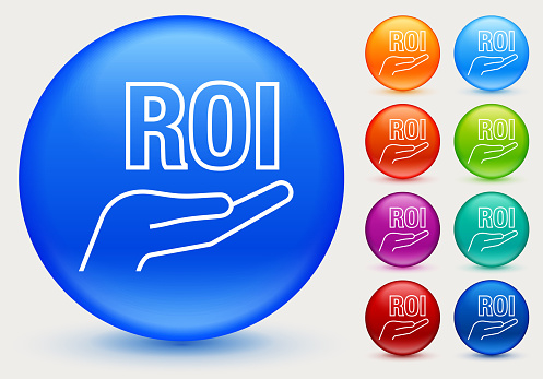 ROI in Hand Profit Icon. This 100% royalty free vector illustration is featuring a blue round button with a drop shadow and the main icon is depicted in white. There are eight more color variations included on the right side of the image.