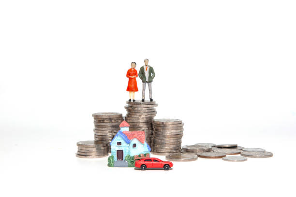 istock Miniature colorful house and car with stack coins using as property and financial concept 1248415449