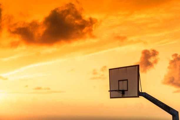 istock basketball basket against sunset sky 1248416257