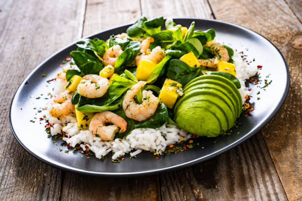 istock Prawns with vegetables on wooden table 1248417053