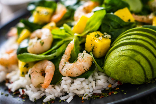 istock Prawns with vegetables on wooden table 1248417222
