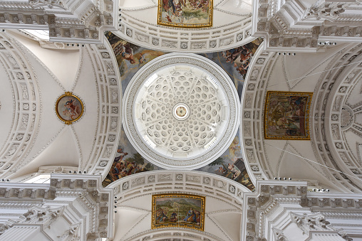 Inside view of the famous Solothurn Cathedral (Cathedral of St. Ursus). This huge church in Neoclasscal Style wasc completet in 1773. The Architects where Gaetano Matteo Pisoni and Paolo Antonio Pisoni. The image shows the stucco ceiling and architectural columns.