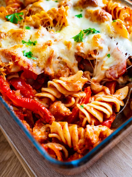 istock Pasta casserole with barbecue chicken breast, cheese and vegetables 1248418135