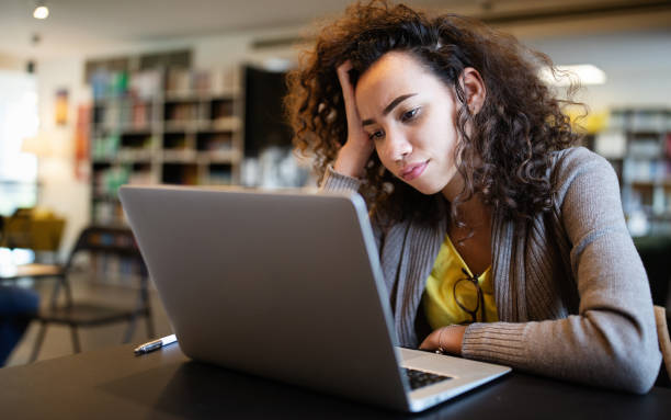 Student woman finding it difficult at study and comprehend scool tasks Student girl finding it difficult at study and comprehend scool tasks ignorance photos stock pictures, royalty-free photos & images