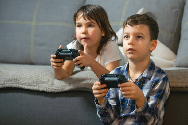 istock kids playing console games during covid 19 outbreak 1248421501