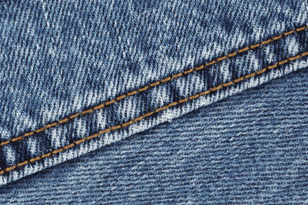 istock Denim jeans seam double stitch close up blue 1248421862